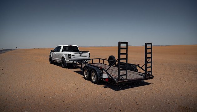 Ute towing a trailer in the outback